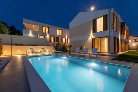 Property building, Night, Pool view, Swimming pool, sunbed