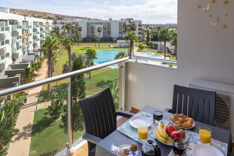 Property building, Day, View (from property/room), Balcony/Terrace, Balcony/Terrace, Dining area, Pool view, Swimming pool