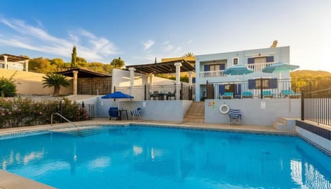 Property building, Pool view, Swimming pool, sunbed