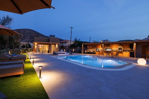 Property building, Patio, Night, Pool view, Swimming pool, sunbed