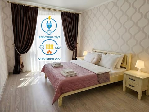 Bed, Property logo or sign, Photo of the whole room, Logo/Certificate/Sign, Bedroom, Certificate/Award, towels