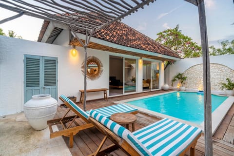 Property building, Living room, Seating area, Pool view, Swimming pool, sunbed