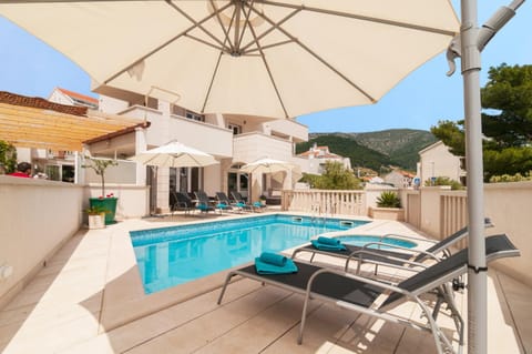 Property building, Patio, Garden, Pool view, Swimming pool