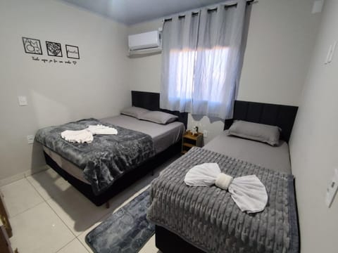 Bed, Photo of the whole room, Bedroom, towels, air conditioner