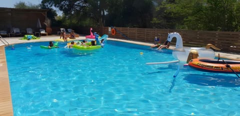 Property building, Living room, Swimming pool