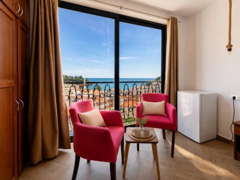 Property building, Day, Natural landscape, View (from property/room), Seating area, Sea view