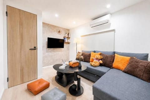 Communal lounge/ TV room, Living room, Seating area, air conditioner
