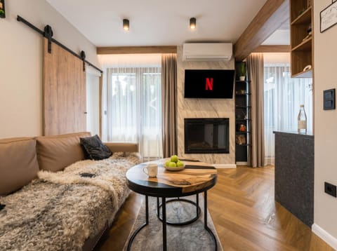 Communal lounge/ TV room, Bed, TV and multimedia, Living room, Photo of the whole room, Seating area, Evening entertainment, Bedroom, air conditioner
