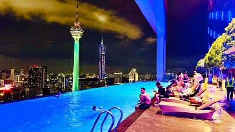 Night, People, View (from property/room), City view, Pool view, Swimming pool, group of guests