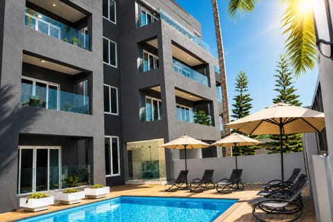 Property building, Patio, Facade/entrance, Day, Garden, View (from property/room), Balcony/Terrace, Pool view, Swimming pool, sunbed