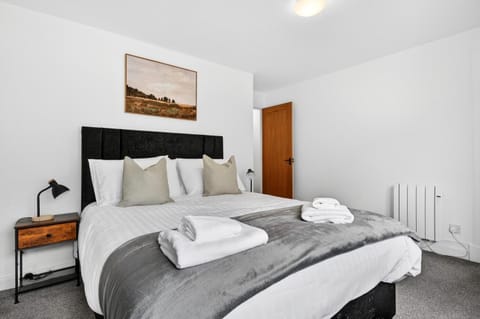 Bed, Bedroom, hair dryier, towels, wardrobe