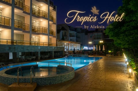 Property building, Restaurant/places to eat, Facade/entrance, Night, View (from property/room), Balcony/Terrace, Text overlay, Pool view, Pool view, Swimming pool, Swimming pool, Breakfast, Seasons, sunbed