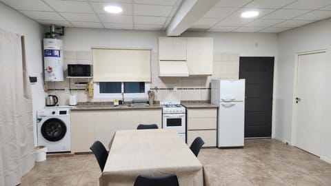 Kitchen or kitchenette, oven, toaster, washing machine