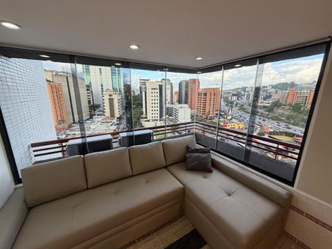 View (from property/room), Balcony/Terrace, Living room, Seating area, City view