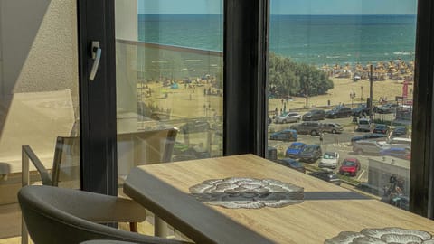 Property building, Day, Natural landscape, View (from property/room), View (from property/room), Balcony/Terrace, Living room, Seating area, Dining area, Beach, Evening entertainment, Sea view, Sea view, Street view, Street view, Parking