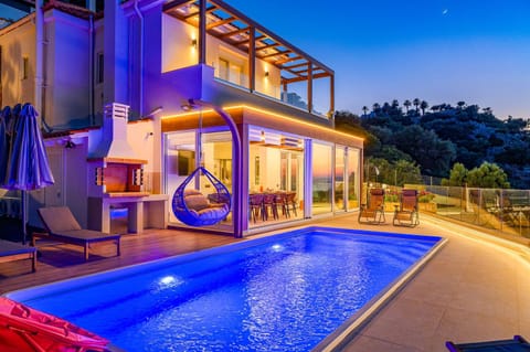 Property building, Patio, Night, Pool view, Swimming pool, sunbed