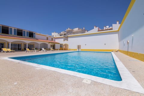 Property building, Living room, Swimming pool