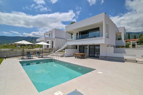 Property building, Natural landscape, Pool view, Swimming pool, sunbed