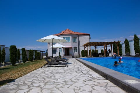 Property building, Pool view, Swimming pool, sunbed