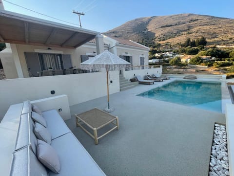 Property building, Patio, Natural landscape, Swimming pool, sunbed