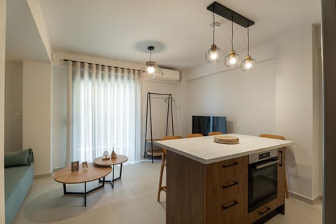 TV and multimedia, Coffee/tea facilities, Kitchen or kitchenette, Living room, Seating area, Dining area, oven, stove, wardrobe, kitchen, air conditioner