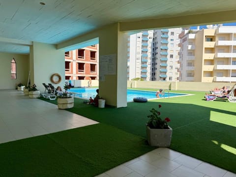 Property building, Living room, Swimming pool