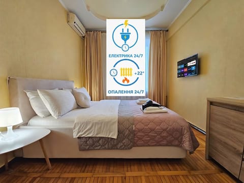 Communal lounge/ TV room, Bed, Property logo or sign, TV and multimedia, Photo of the whole room, Evening entertainment, Logo/Certificate/Sign, Bedroom, Text overlay, Certificate/Award