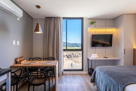 Bed, TV and multimedia, View (from property/room), Kitchen or kitchenette, Living room, Dining area, Bedroom