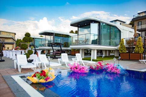 Property building, Pool view, Swimming pool, sunbed