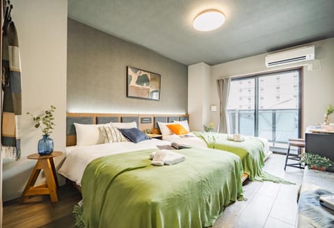 Photo of the whole room, Bedroom, towels, air conditioner