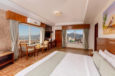 Bed, Natural landscape, Living room, Photo of the whole room, Seating area, Bedroom, Lake view, Mountain view, wardrobe, air conditioner