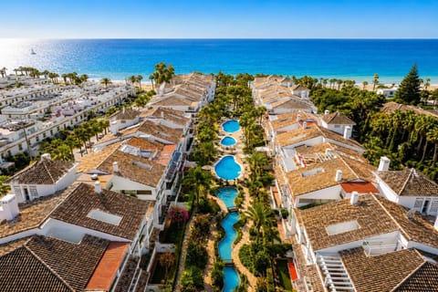 Property building, Bird's eye view, Beach, Swimming pool