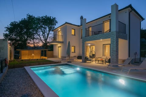 Property building, Patio, Night, Pool view, Swimming pool, sunbed