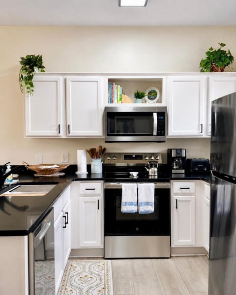 Kitchen or kitchenette, dishwasher, microwave, oven, stove, toaster