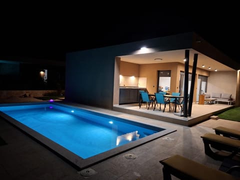 Patio, Night, Pool view, Swimming pool, sunbed
