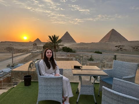 Property building, Patio, Nearby landmark, Day, People, Natural landscape, Living room, Seating area, Sunrise, Sunset, group of guests
