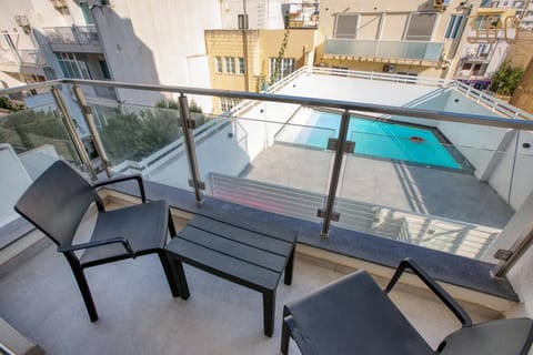 Patio, Day, View (from property/room), Balcony/Terrace, Living room, Seating area, Pool view, Swimming pool, sunbed