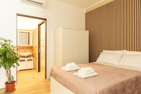 Bed, Bedroom, towels, wardrobe, air conditioner