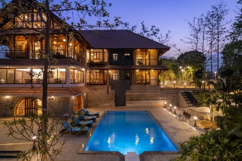 Property building, Patio, Night, Natural landscape, Pool view, Swimming pool, sunbed
