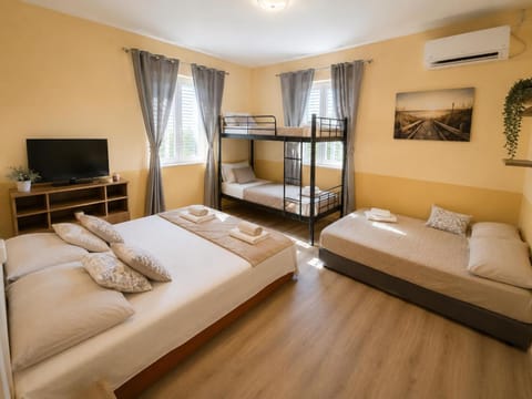 Property building, Bed, Photo of the whole room, Bedroom, towels, air conditioner