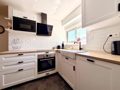 Kitchen or kitchenette, dishwasher, oven, stove, toaster