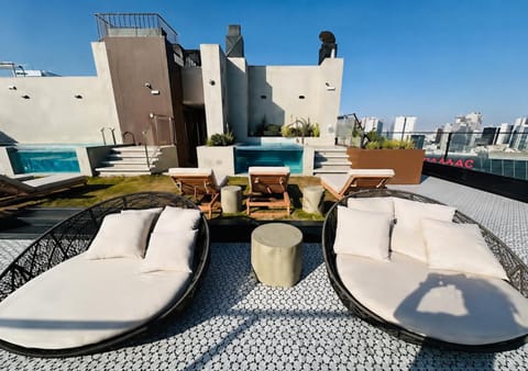 Property building, View (from property/room), Balcony/Terrace, Living room, Seating area, Pool view, Swimming pool, sunbed