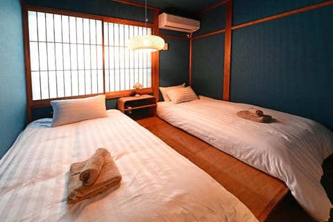 Bed, Photo of the whole room, Bedroom, towels, air conditioner