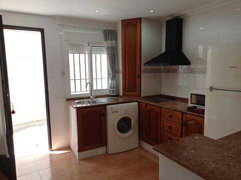 Kitchen or kitchenette, stove, washing machine