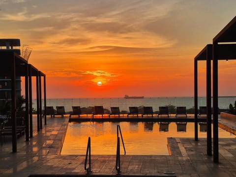 Natural landscape, Balcony/Terrace, Pool view, Sea view, Swimming pool, Sunset, sunbed