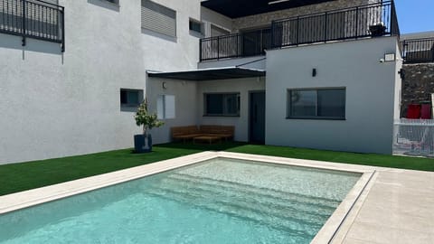 Property building, Patio, Day, Pool view, Swimming pool