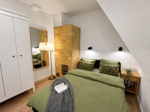 Bed, towels, wardrobe