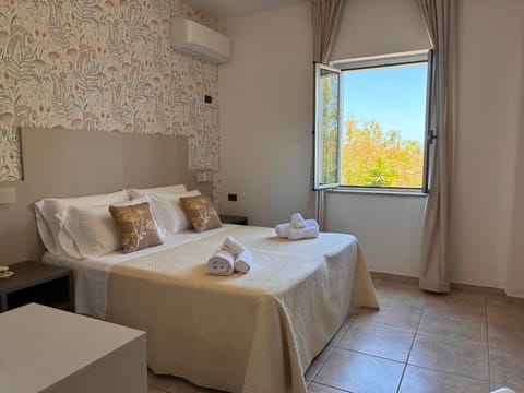 Bed, Photo of the whole room, Bedroom, towels, air conditioner
