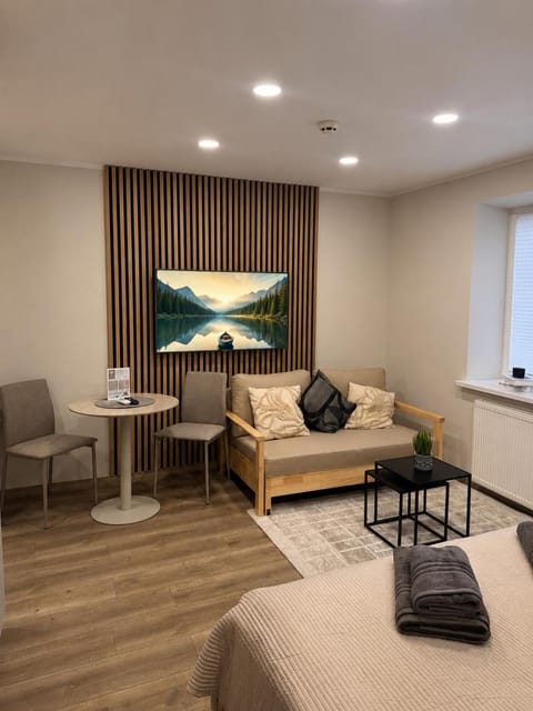 Bed, Living room, Seating area, Bedroom