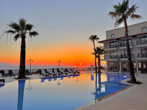 Property building, Natural landscape, Pool view, Sea view, Swimming pool, Sunset, sunbed
